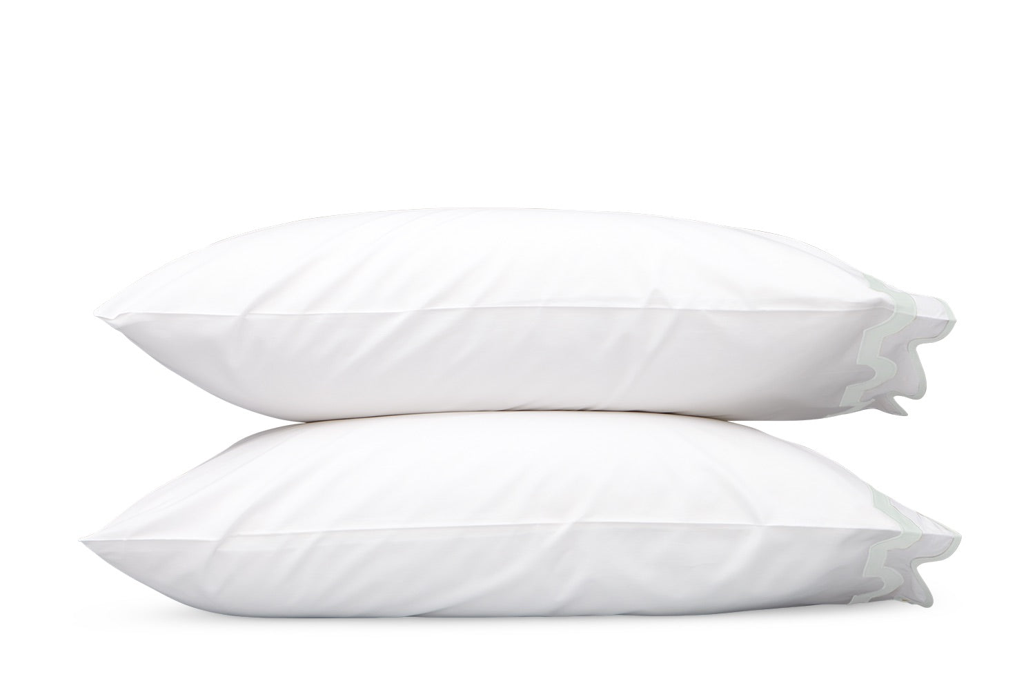 Two white pillows from the Matouk Mirasol Bedding Collection, crafted from luxurious Egyptian cotton percale, are stacked on top of each other against a plain white background.