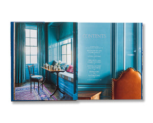 Open to More Rooms by Vendome, displaying a blue-paneled Katie Ridder interior with window seat and leather chair, next to a contents page on blue background, hinting at the book’s rich decorating ingenuity and design inspiration.