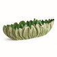 The Winslow Bowl Collection by Napa Home & Garden features oval ceramic bowls with a leaf-textured exterior and green reactive glaze interior—an eye-catching handcrafted stoneware centerpiece for your table.