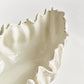 Close-up of a Winslow Bowl from Napa Home & Garden, featuring a handcrafted stoneware design with a wavy textured rim and glossy finish, photographed against a plain white background.