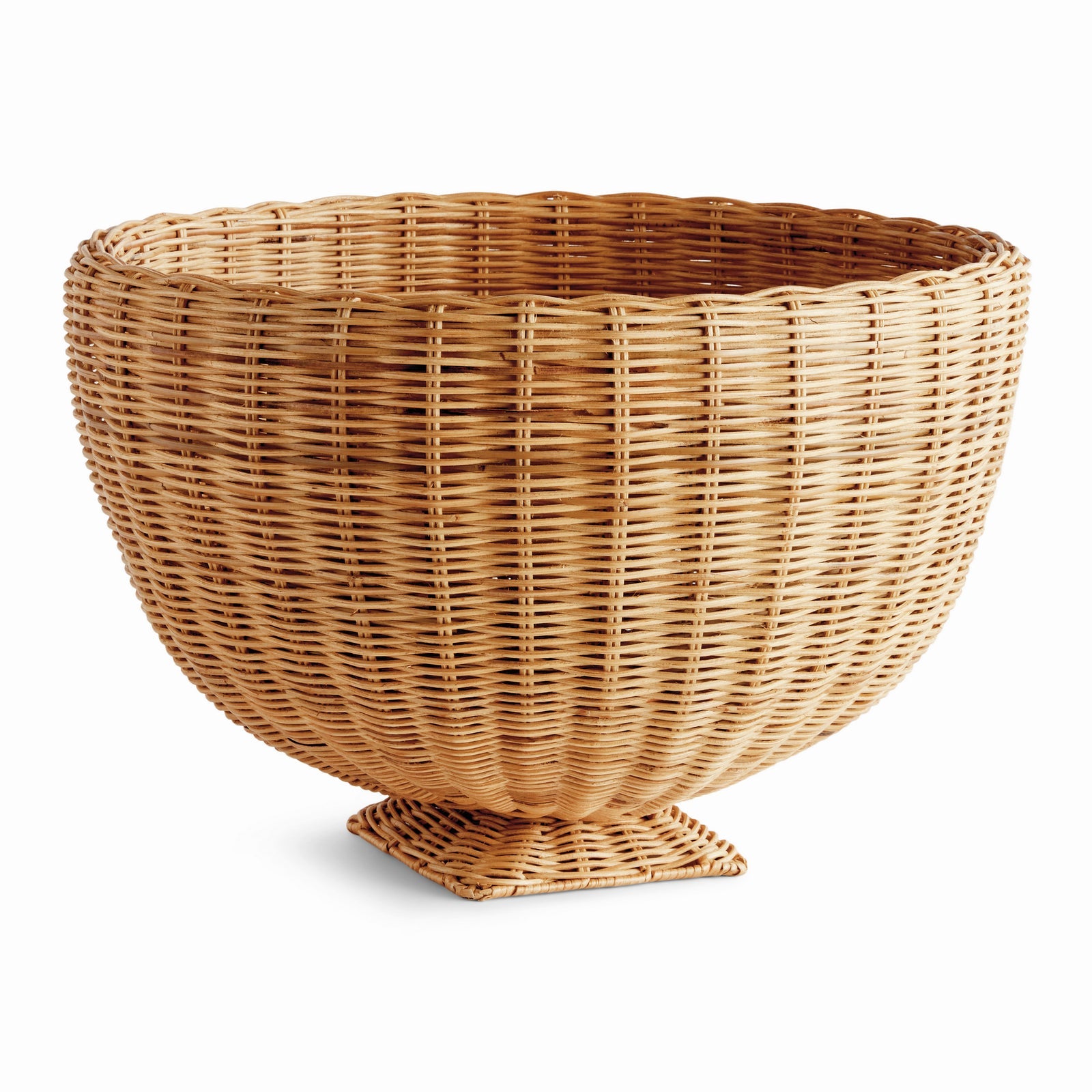 The Charleston Rattan Footed Bowl by Napa Home & Garden features a large, round woven design with a wide opening and small square base, making it an eye-catching table centerpiece against a white background.