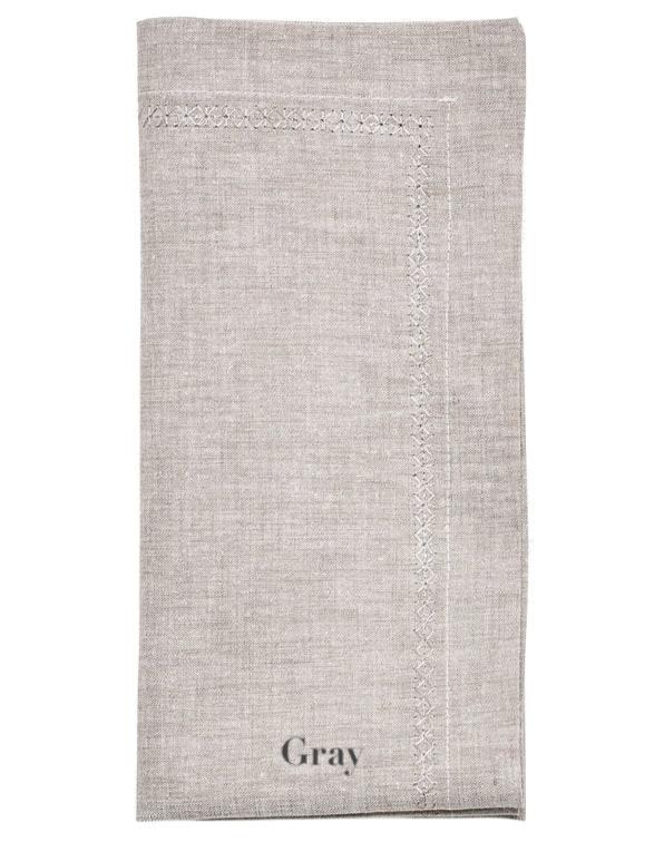 A classic gray linen napkin from the Kim Seybert Classic Napkin Set, featuring an embroidered border and "Gray" elegantly printed at the bottom.