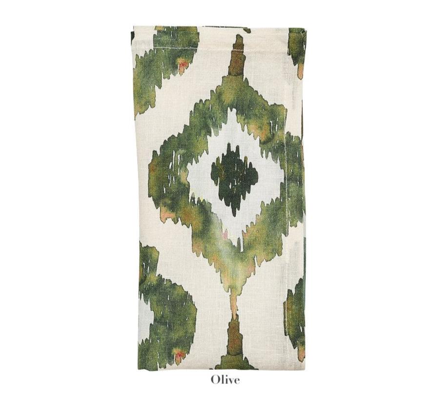 The Watercolor Ikat Napkin Set by Kim Seybert features olive green and white hand-painted designs, displayed folded against a white background to showcase its unique charm.