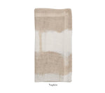 A white and natural 100% linen napkin from Kim Seybert’s Watercolor Stripe Collection, folded neatly against a white background. "Napkin" is written below—perfect for elevating your summer dining table.
