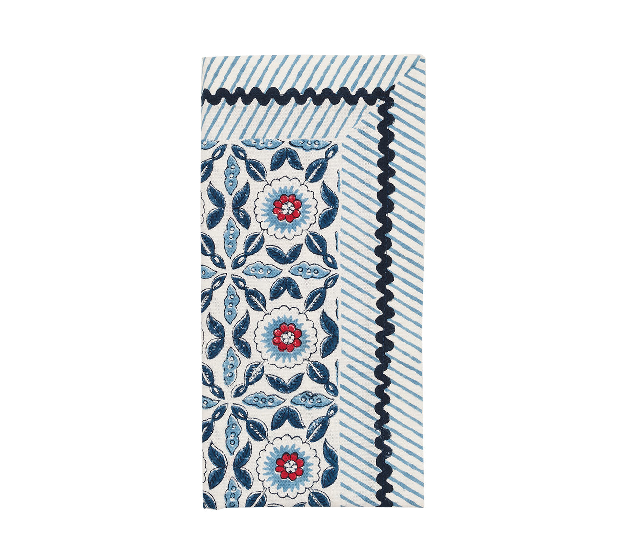 The Kim Seybert Majorelle Napkin Set features blue and white stripes, floral patterns with red and dark blue accents, wavy trim borders, and is expertly handcrafted using Indian block printing techniques.