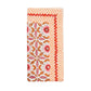 The Kim Seybert Majorelle Napkin Set features rectangular handcrafted napkins with a red and orange floral center inspired by Indian block printing, bordered by orange diagonal stripes and a zigzag design.