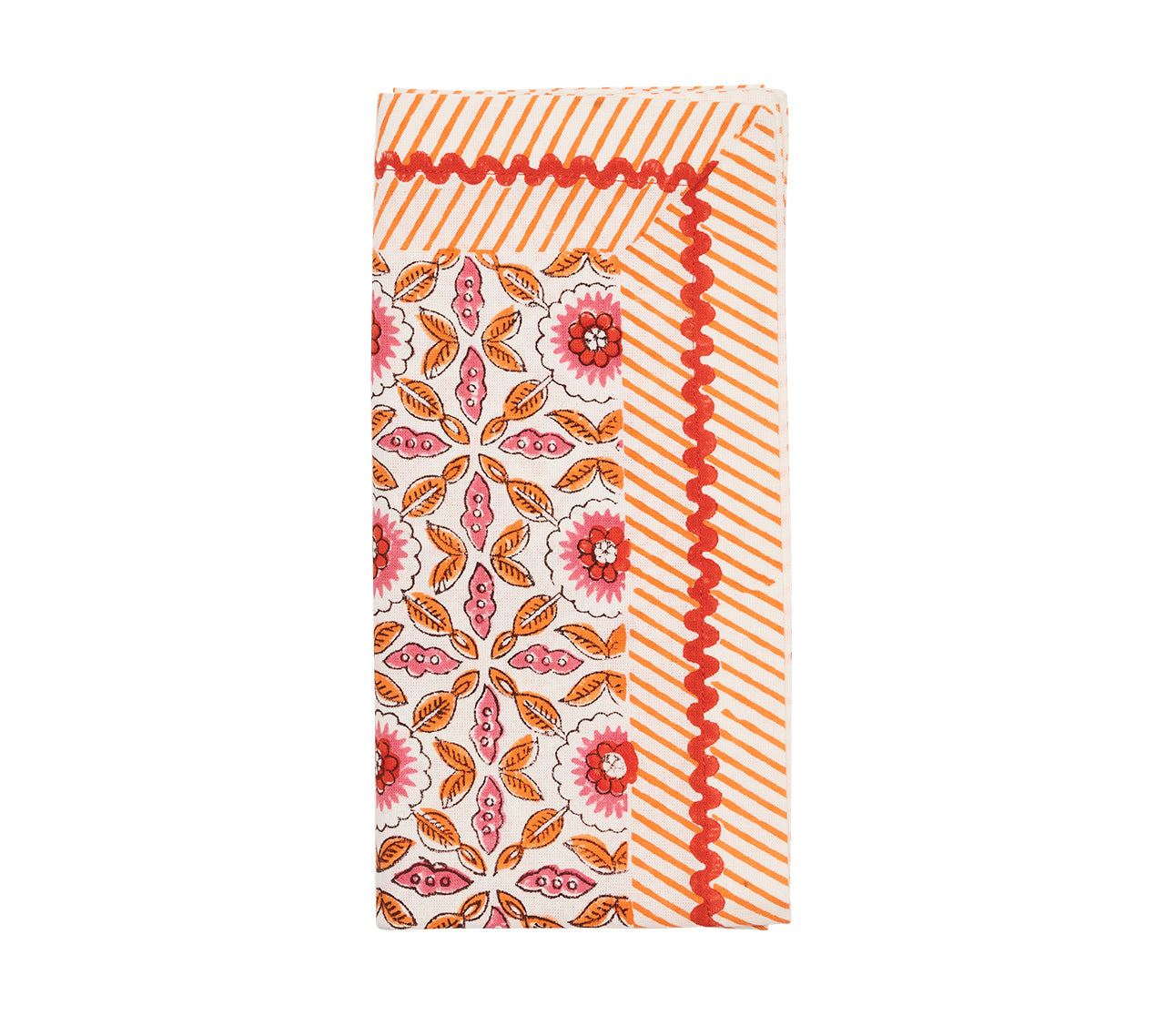The Kim Seybert Majorelle Napkin Set features rectangular handcrafted napkins with a red and orange floral center inspired by Indian block printing, bordered by orange diagonal stripes and a zigzag design.