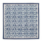 The Alfresco Napkin Set by Kim Seybert features a dark blue and white geometric pattern inspired by block printing, with repeating diamond shapes, stylized floral designs, and a solid blue border.