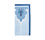 The Kim Seybert Filigree Napkin Set features rectangular blue and white napkins with floral and geometric patterns, vertical stripes, and dark blue borders—ideal for enhancing any table setting.