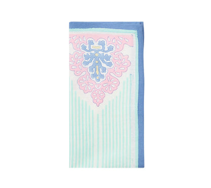 The Kim Seybert Filigree Napkin Set features folded napkins with pastel floral and stripe patterns in blue, pink, and mint green, bringing artisanal craftsmanship to any table setting.