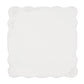 The Bloom White Napkin Set by Kim Seybert features square white linen napkins with scalloped edges, subtle floral patterns in two corners, and delicate eyelet embroidery for a touch of vintage charm.