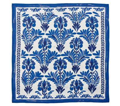 The Kim Seybert Botanica Napkin Set features rectangular linen napkins with a blue floral print and matching border on white—a stylish, vintage-inspired table decor accent.