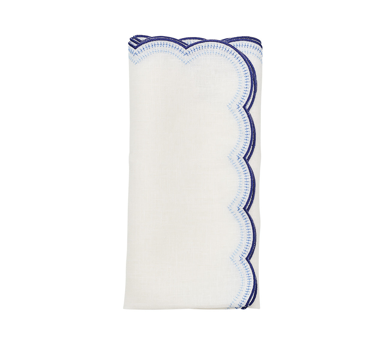 The Lune Napkin Set by Kim Seybert features folded white napkins with scalloped edges and blue stitching, perfect for elevating any table setting.