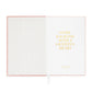 Introducing the Sugar Paper Flax Gratitude Journal: This open pink notebook showcases a striped inner cover and a white page adorned with gold text reading, “Start each day with a grateful heart.” Perfect for your daily check-in or as a gratitude journal, it features thoughtful prompts and includes a white ribbon bookmark.