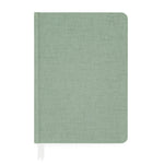 The Sage Tailored Journal by Sugar Paper is a closed, light green hardcover notebook with a fabric texture, featuring a white ribbon bookmark and lined pages for organized writing.