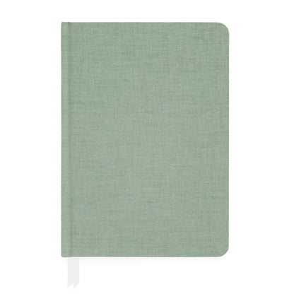 The Sage Tailored Journal by Sugar Paper is a closed, light green hardcover notebook with a fabric texture, featuring a white ribbon bookmark and lined pages for organized writing.