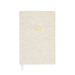 The Flax Gratitude Journal by Sugar Paper is a beige linen-covered journal with elegant gold “Daily Gratitude Journal” text, featuring thoughtful prompts and a white ribbon bookmark to guide your daily reflections.