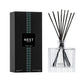 The Nest Forest Rain Scent Collection reed diffuser set features a sleek black box and clear glass bottle with black reeds, filling your space with aquatic notes and subtle fig leaf fragrance.