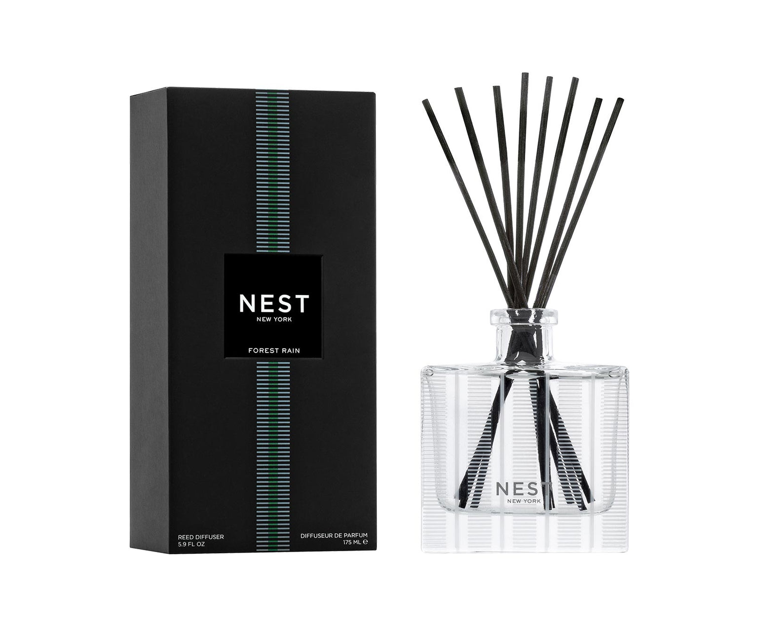 The Nest Forest Rain Scent Collection reed diffuser set features a sleek black box and clear glass bottle with black reeds, filling your space with aquatic notes and subtle fig leaf fragrance.