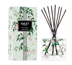 Nest's Indian Jasmine Decorative Reed Diffuser features premium fragrance oils in a clear glass bottle with black reeds, packaged in a floral box for an elegant touch and soothing aroma.