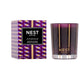The Nest Autumn Plum Candle Collection features premium scented candles in elegant purple and gold packaging, displayed next to a matching fall glass holder.