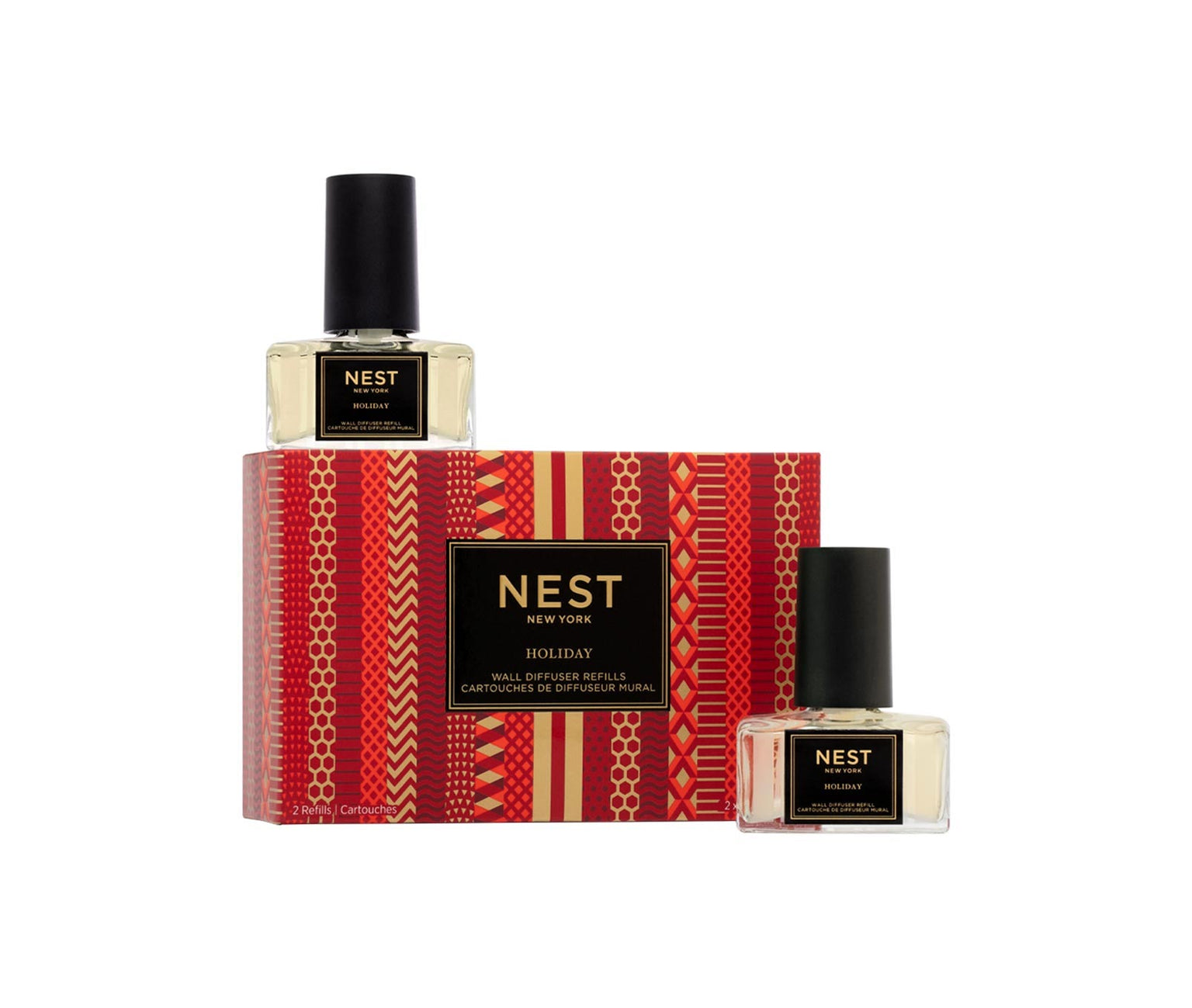 The Nest NEST Holiday Collection diffuser refill set includes two bottles in a festive red and gold box—ideal for enhancing your space with the signature holiday scent.