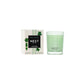 A Nest Cucumber & White Sage Scent Collection candle sits in a green glass holder beside its box adorned with green leaves, reflecting the refreshing and soothing fragrance of cucumber.