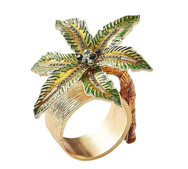 The Kim Seybert Palm Coast Napkin Ring, Set of 4 features a detailed green and brown palm tree motif—an elegant, nature-inspired accent for your table décor.