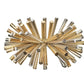 The Kim Seybert Fringe Napkin Ring is a decorative metallic accessory with gold and silver rods and metal beads radiating from the center, adding a glamorous touch to your table setting.