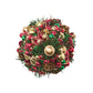 Kim Seybert Tinsel Tree Napkin Ring, a spherical holiday dining accessory decorated with miniature pine needles, plaid ribbon, and red, green, and gold ornaments.