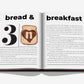 An open book from Assouline features the heading "bread & breakfast" and an image of toast with a heart-shaped Nutella spread and the letter "n," plus stylized text on both pages.