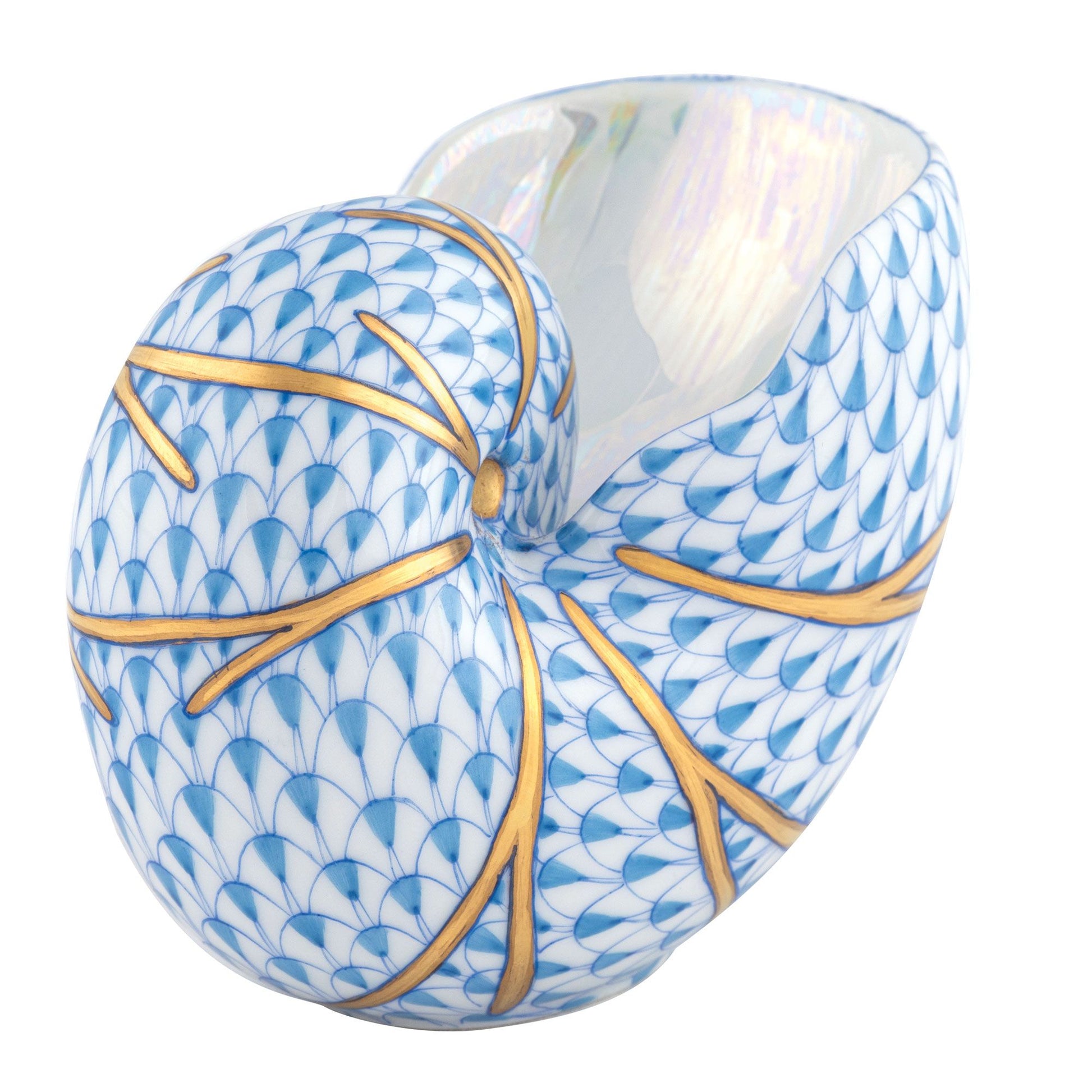 The Herend Small Nautilus Shell is a porcelain vase with hand-painted blue scale patterns and gold branch-like lines, plus a glossy, iridescent white interior.