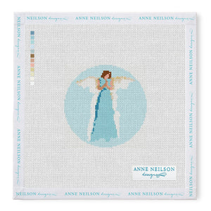 The Anne Neilson Needlepoint Kits feature an angel in a blue dress with wings on a light blue round canvas; beginner-friendly with color key included.