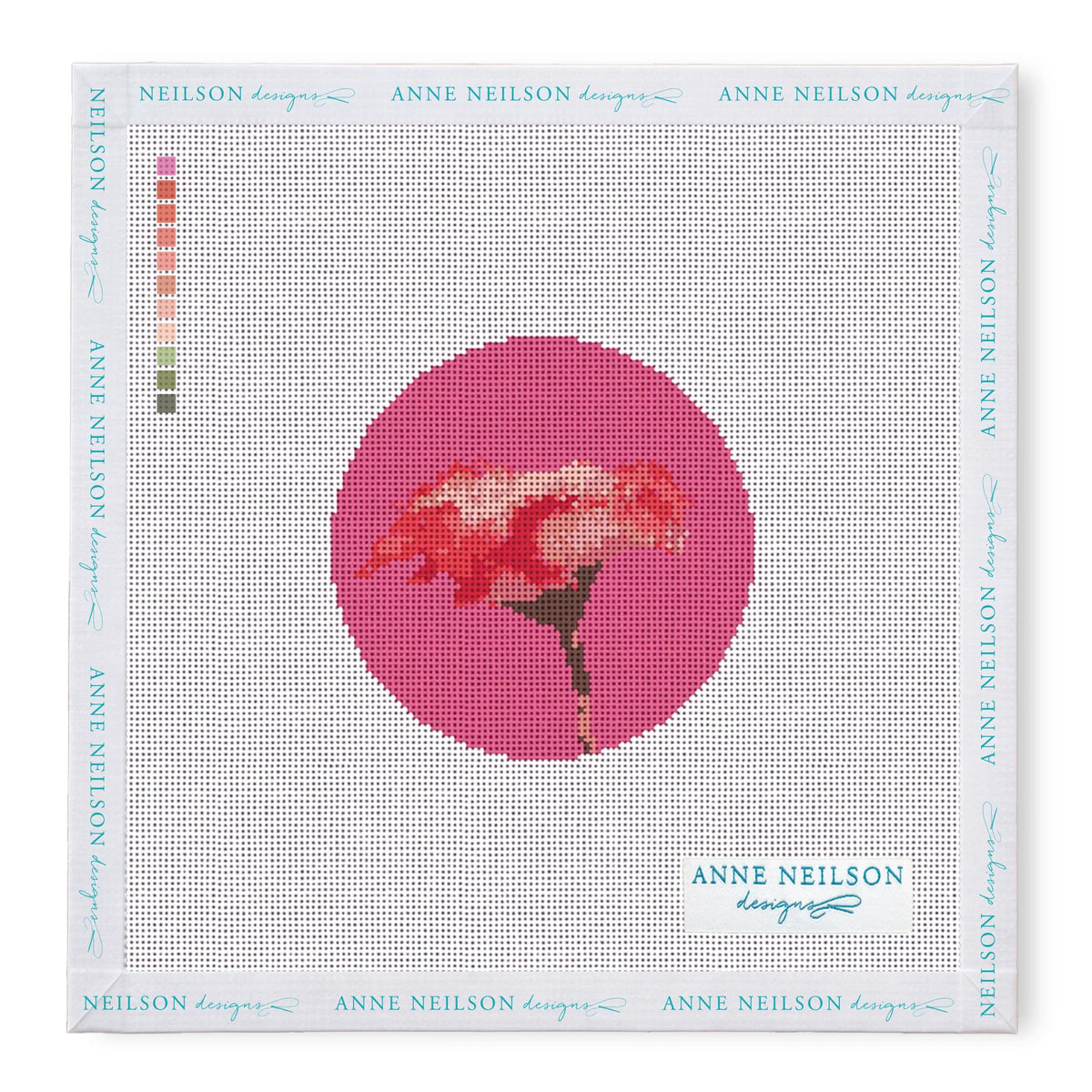 Needlepoint Kits by Anne Neilson: beginner kit with stitch-printed canvas of a pink flower in a magenta circle, color guide, and Anne Neilson branding.