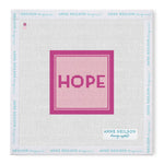 Square stitch-printed canvas with “HOPE” in pink and dark borders. Perfect for Anne Neilson Needlepoint Kits; frame features blue brand text.