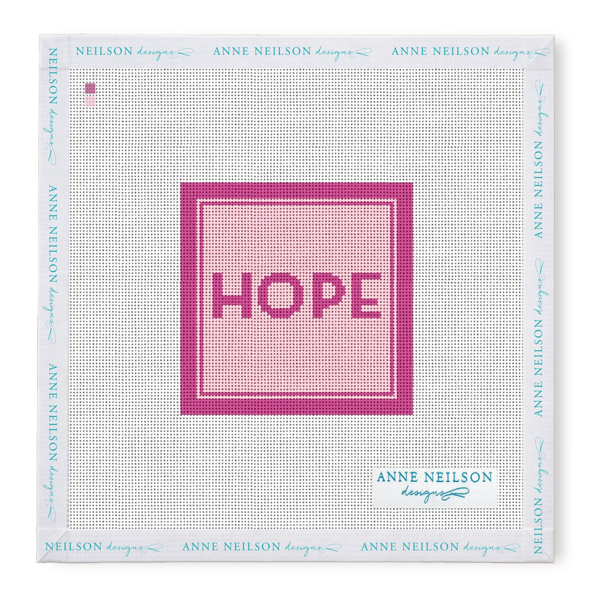 Square stitch-printed canvas with “HOPE” in pink and dark borders. Perfect for Anne Neilson Needlepoint Kits; frame features blue brand text.