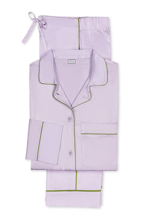 The Nocturne Pajama Set by Matouk features light purple Egyptian cotton pajamas with dark green piping—includes a long-sleeve shirt, pants, and matching drawstring pouch—crafted for luxurious leisurewear.