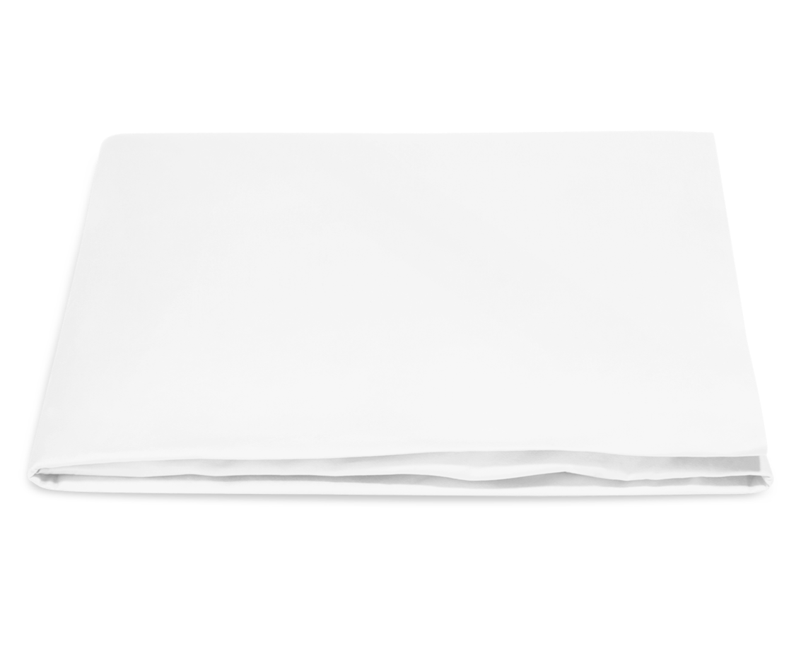 The Nocturne White Flat Sheet Collection by Matouk, crafted from luxurious Egyptian cotton, is displayed neatly folded on a plain white background.