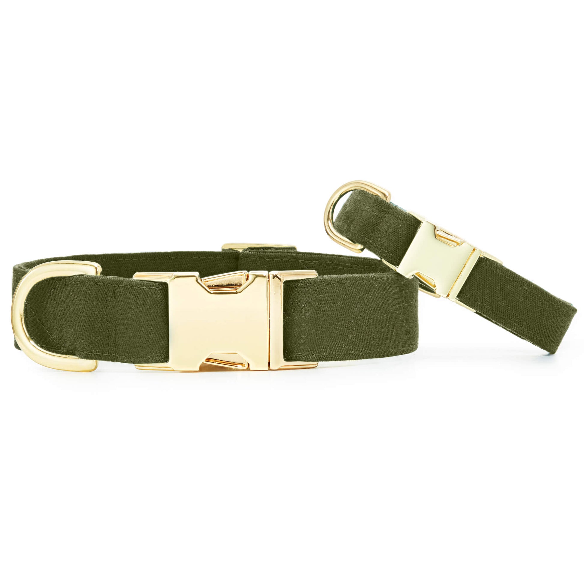 Two neutral olive green fabric collars from The Foggy Dog, featuring gold hardware buckles and D-rings, are displayed on a white background.