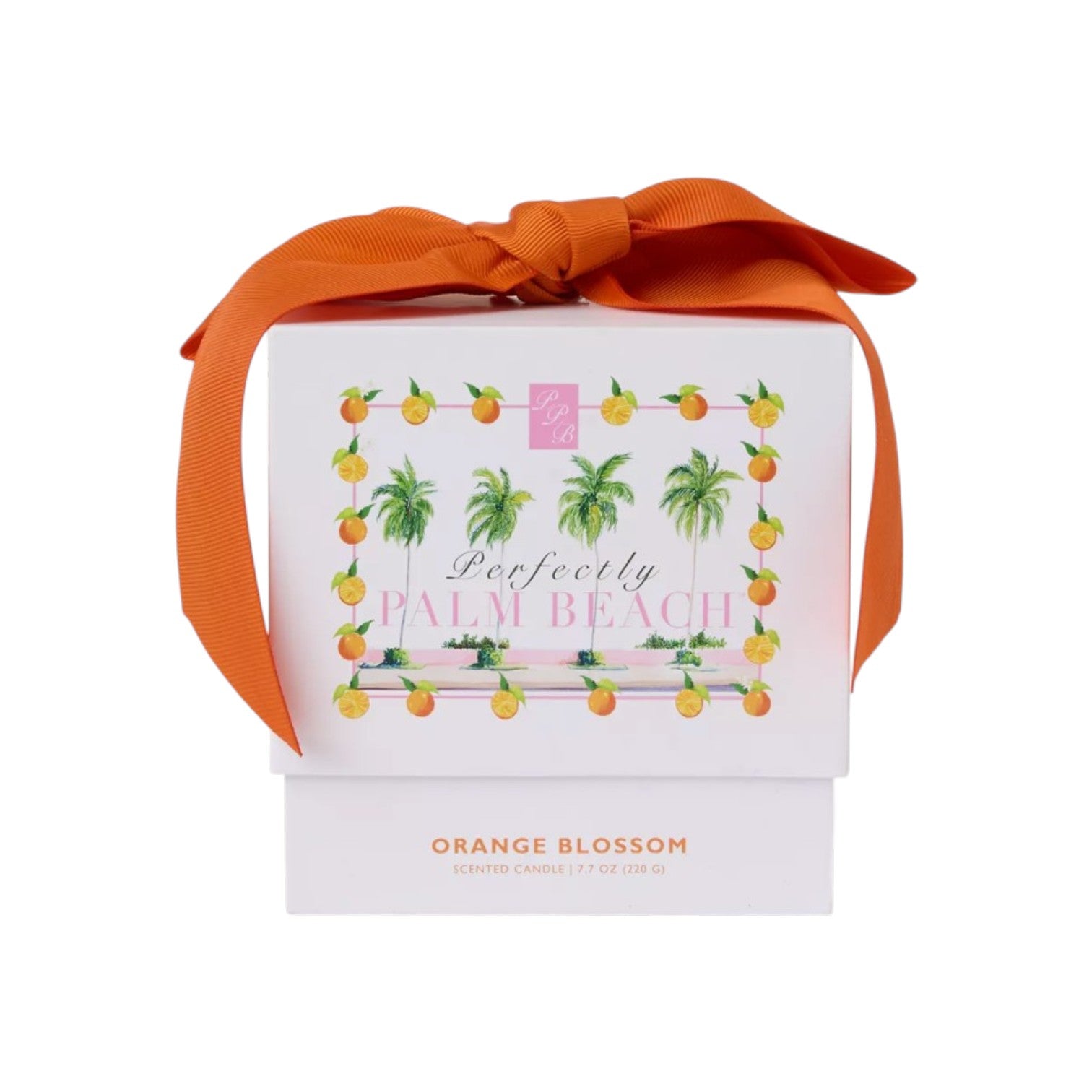A white box with an orange ribbon and a "Perfectly Palm Beach" label holds the Orange Blossom Candle by Perfectly Palm Beach, inspired by Lilly Pulitzer for a luxurious Palm Beach touch.