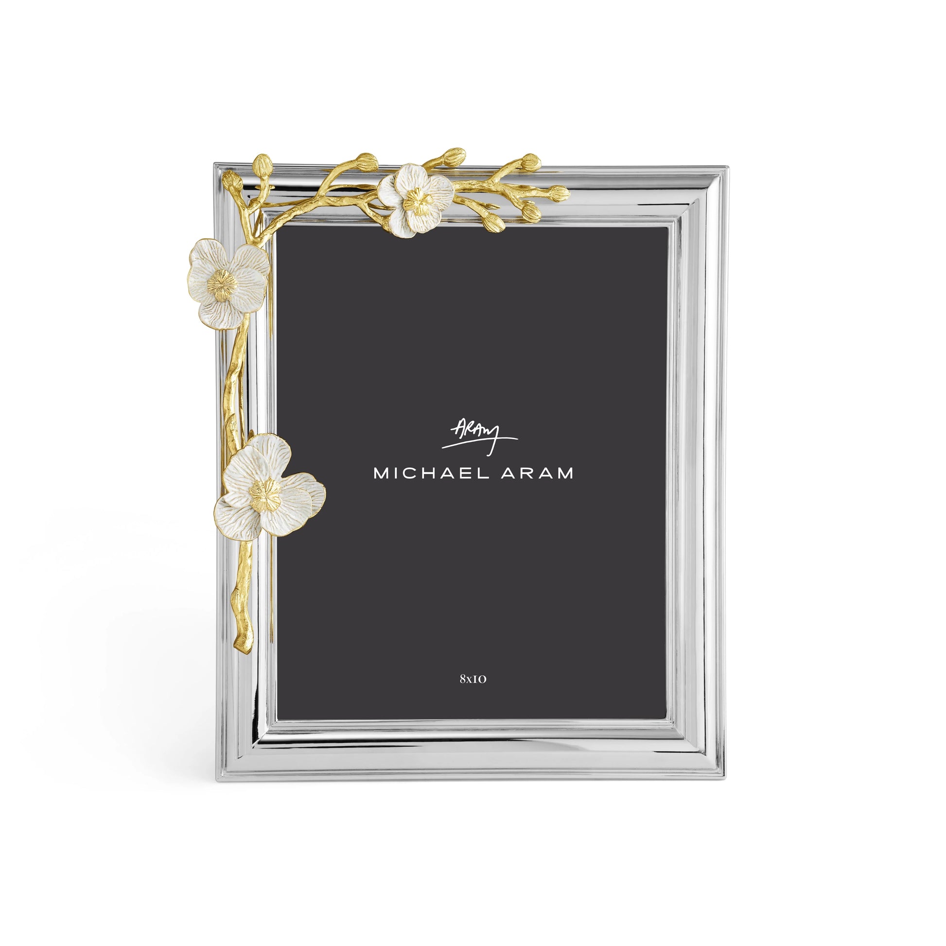 The Michael Aram Orchid Frame features gold floral accents on a silver base, with the brand name displayed on a black insert—an elegant piece symbolizing purity and grace from the Orchid Collection.