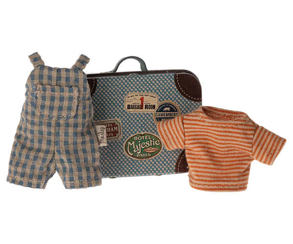 A small metal suitcase featuring travel stickers, a plaid overall, and a striped shirt are displayed together as part of the Maileg Overalls & Shirt in Suitcase set for Big Brother Mouse.