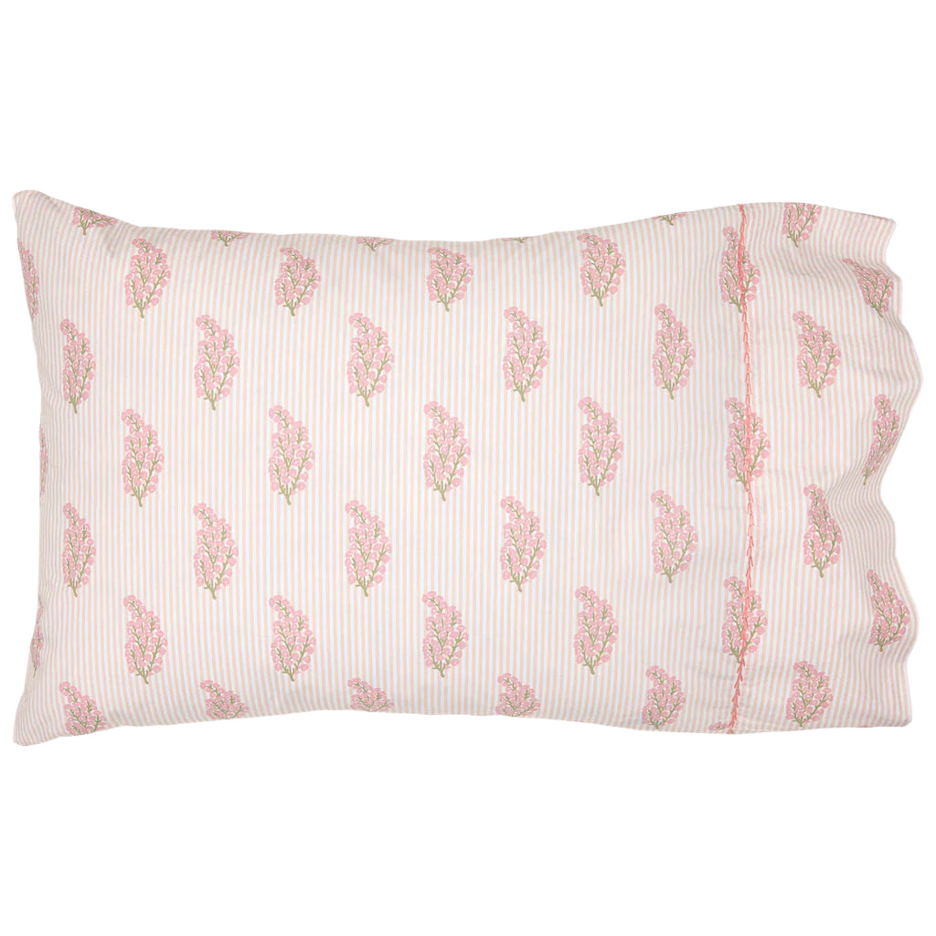 The Nirvi Lotus Bedding Collection by John Robshaw features a rectangular pillowcase with pink and green floral block print and subtle stripes on a white background.
