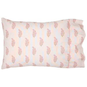 The Nirvi Lotus Bedding Collection by John Robshaw features a rectangular pillowcase with pink and green floral block print and subtle stripes on a white background.