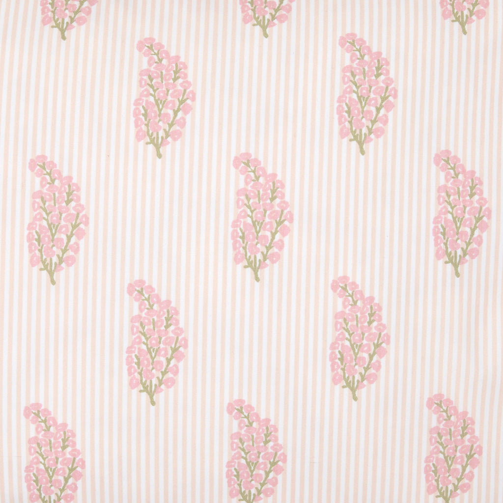 The Nirvi Lotus Bedding Collection by John Robshaw features pink and green floral sprigs in a charming block print style, repeating neatly over a beige and white subtly striped background.