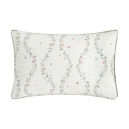 The Botanical Berries Bedding Collection by Gooselings features a rectangular white children’s pillow with a floral vine pattern of red and blue berries, finished with dark piping—ideal for sweet dreams.