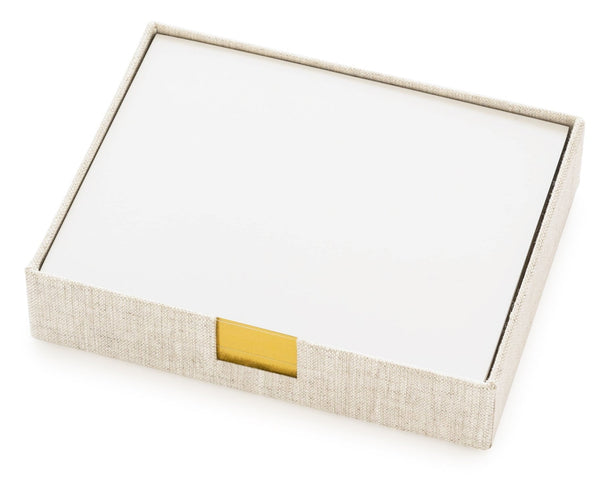 The Sugar Paper Desk Jotter in Flax, crafted by Sugar Paper, is a beige chambray fabric holder with a lid and a gold accent on the front edge, ideal for storing gold foil-edged note cards.