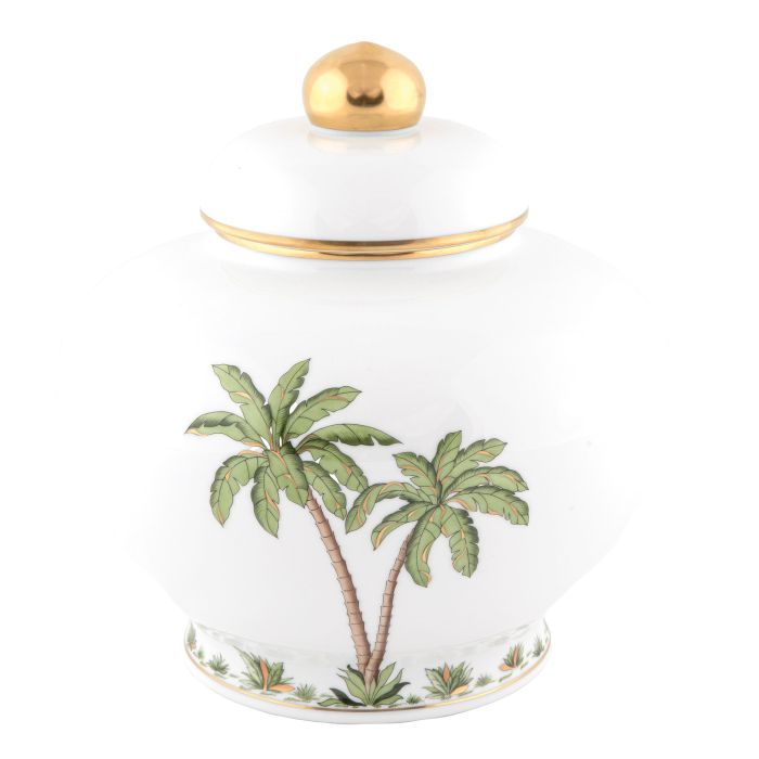 Herend's Palm Tree Decor Collection features a white ceramic jar with gold knob and rim, adorned with hand-painted green palm trees and plants—an elegant accent for any space.