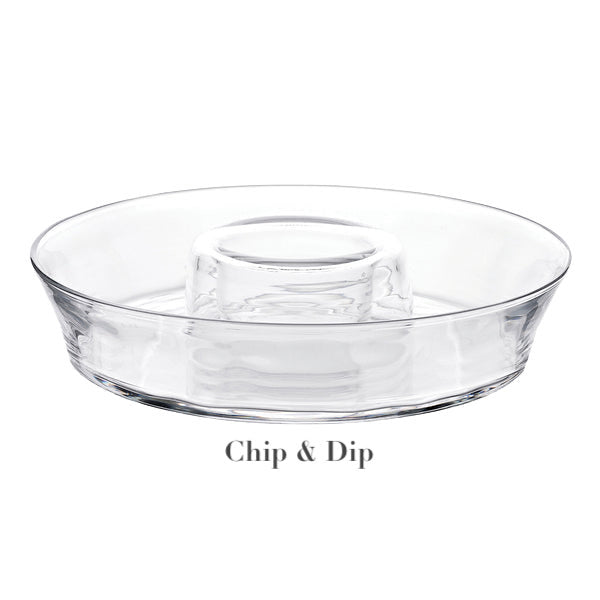 The Juliska Puro Glass Serveware Collection chip and dip platter features elegant textural lines, a central dip compartment, and a surrounding area for chips.