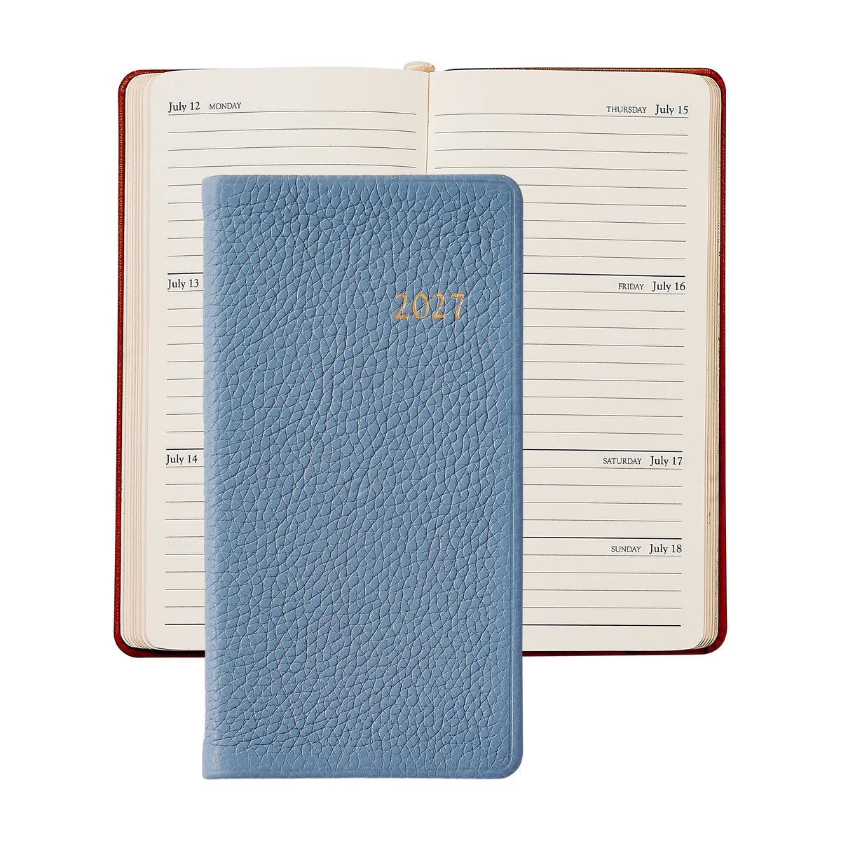 A blue 2021 leather planner is placed on top of an open weekly planner displaying the week of July 12 to July 18, accompanied by the Graphic Image 2027 Pocket Datebook for convenient daily notes.